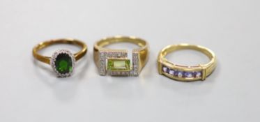 A peridot and diamond set 9ct gold ring, a 9ct gold cluster ring and a 9ct gold line-set five-stone