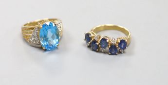 A sapphire and diamond double line ring, 9ct gold shank and another 9ct gold ring set blue and