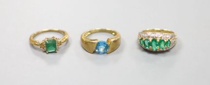 Two 9ct gold emerald-set rings and another 9k gem-set ring,gross weight 10.1 grams.