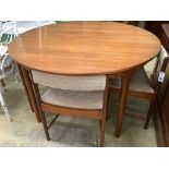 A mid century design Macintosh circular teak extending dining table and four chairs, model 9533,