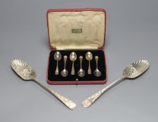 Two similar George III silver berry spoons, London, 1805 & 1814 and a cased set of six silver