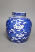 An early 20th century Chinese blue and white prunus jar and cover, height 26cm