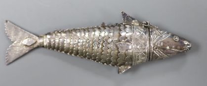 A continental white metal articulated fish pill box, with hinged head,11cm.