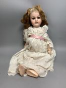 A French Mon Cheri doll, with jointed body, height 20 inches,51cm