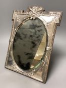 An Edwardian silver mounted easel mirror, with oval plate, James Deakin & Sons, Birmingham, 1908,