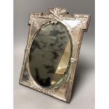 An Edwardian silver mounted easel mirror, with oval plate, James Deakin & Sons, Birmingham, 1908,