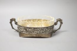 An early 20th century Russian white metal two handled oval dish with glass liner,overall length 23.