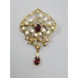 An early 20th century yellow metal, garnet and seed pearl set drop brooch( pearl missing), 47mm,