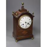 An inlaid mahogany mahogany mantel clock with brass ball finials, height 28cm