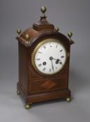 An inlaid mahogany mahogany mantel clock with brass ball finials, height 28cm