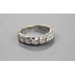 A modern 18ct white gold and seven stone diamond set half hoop ring,size O, gross 4.8 grams, total