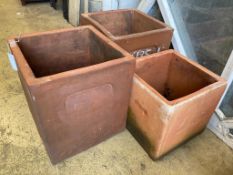 Three square terracotta planters, largest 36cm wide, height 40cm