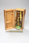 A brass monocular microscope, cased