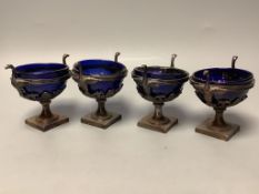 A set of four 19th century French pierced white metal circular pedestal salts with swan neck