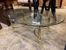 A contemporary glass topped brass oval coffee table, length 126cm, width 66cm, height 41cm