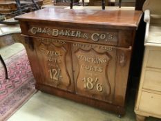 A tailor's bespoke carved mahogany shop cabinet, fitted two panelled doors, inscribed to the front