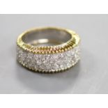 A modern 18ct gold and pave set diamond dress ring,size M/N, gross 9.3 grams.