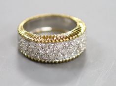 A modern 18ct gold and pave set diamond dress ring,size M/N, gross 9.3 grams.