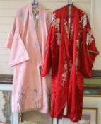 A pink silk Japanese kimono embroidered with wisteria and irises and butterflies, length 140cm,