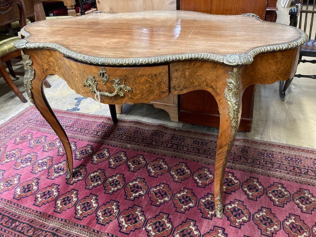 A 19th century French marquetry and kingwood centre table, (having later walnut-veneered top) width