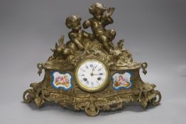 Louis XVI style bronze mantel clock with Sevres style porcelain plaques