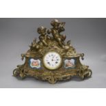 Louis XVI style bronze mantel clock with Sevres style porcelain plaques