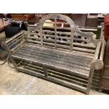 A Lutyens style weathered teak garden bench, length 166cm, depth 54cm, height 110cm