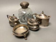 Three assorted silver mustard pots, a silver mounted glass scent bottle and Georgian silver salt.