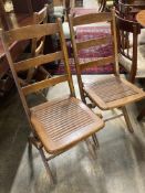 A set of eight early 20th century beech folding garden chairs