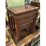 A Chinese nest of hardwood quartetto tables, largest 50cm