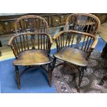 A harlequin set of seven early 19th century yew and elm splat back elbow chairs