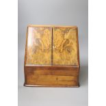 A Victorian walnut stationery box with fitted interior, height 31cm