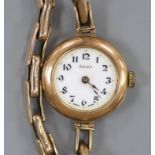 A lady's early 20th century 9ct gold Rolex manual wind wrist watch, on a 9ct flexible bracelet (no