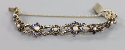 A continental gilt white metal, sapphire and split pearl flower head cluster set bracelet,approx.