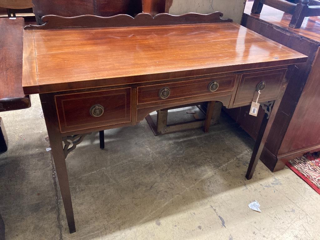 A George III style kneehole dressing table, width 114cm, depth 57cm, height 82cm