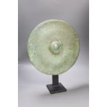 A Cambodian bronze gong, Khmer 12th/13th century, later metal standProvenance: The vendor acquired