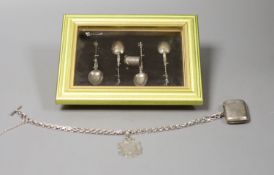 Four silver apostle spoons, a silver vesta case on chain and a silver medallion.
