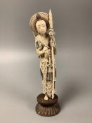 A Chinese ivory figure of Hua Mulan, early 20th century, height 26cm including wood stand