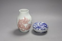 A Chinese underglaze copper red vase and a Chinese blue and white ‘dragon’ box and cover, tallest