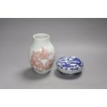 A Chinese underglaze copper red vase and a Chinese blue and white ‘dragon’ box and cover, tallest