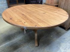 A Victorian style circular pine breakfast table, diameter 152cm height 71cm, together with a ply