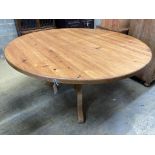 A Victorian style circular pine breakfast table, diameter 152cm height 71cm, together with a ply