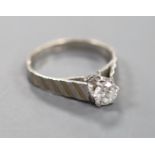 A modern 18ct white metal and solitaire diamond ring, with engraved shoulders,size P, gross 4.2