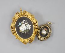 A Victorian yellow metal mounted pietra dura set oval pendant brooch, with fruiting vine border,