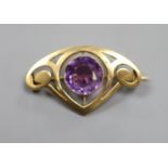 An early 20th century Art Nouveau yellow metal and amethyst set stylised brooch,36mm, gross weight