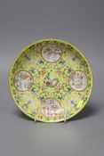 A Chinese yellow ground medallion saucer dish, Jiaqing mark, 19th century, diameter 20cm