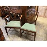 A set of eight George III mahogany shield back dining chairs (two with arms)