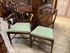 A set of eight George III mahogany shield back dining chairs (two with arms)