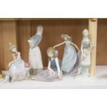 Four Lladro figurines and one Lladro style figurine, height 27cm