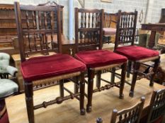 A harlequin set of eleven 19th century ash spindle back rush seat chairs(two having arms)